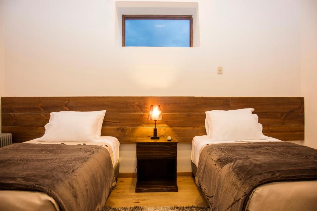 Postel nebo postele na pokoji v ubytování Hotel Casa Fierro Cusco