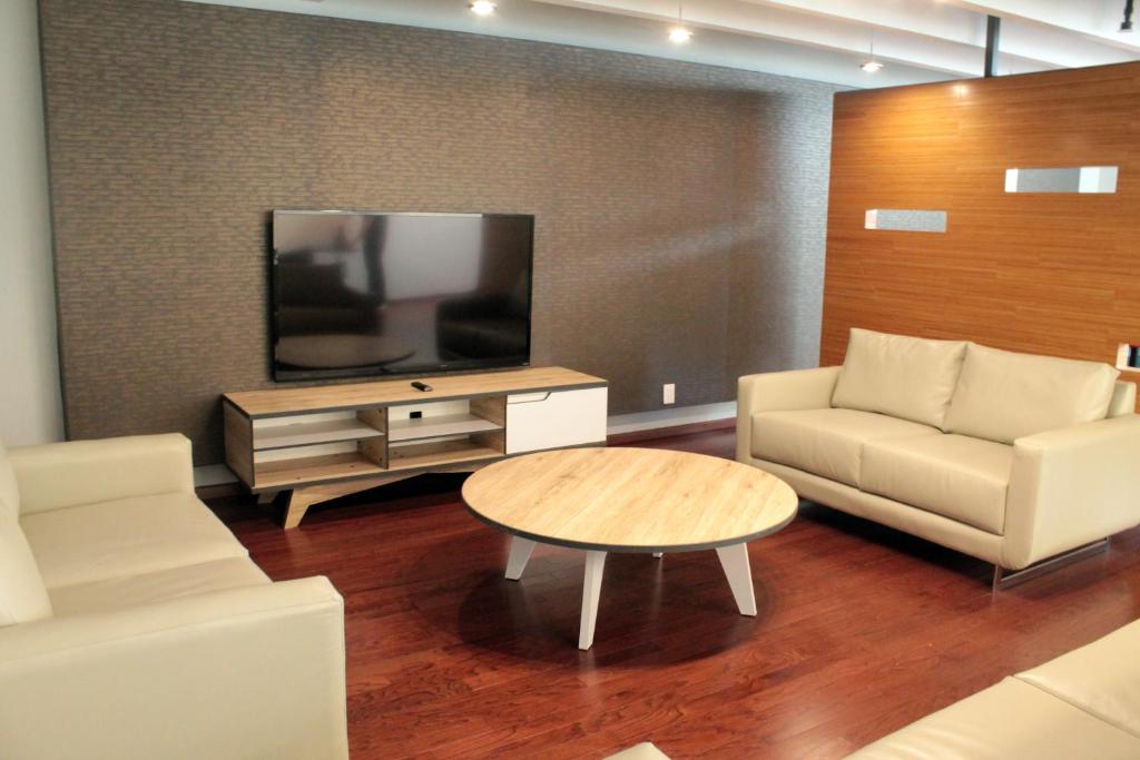 TV a/nebo společenská místnost v ubytování Casa Inn Business Irapuato