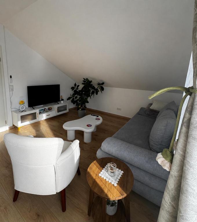 a living room with a couch and a tv at Apartment D&A in Albbruck