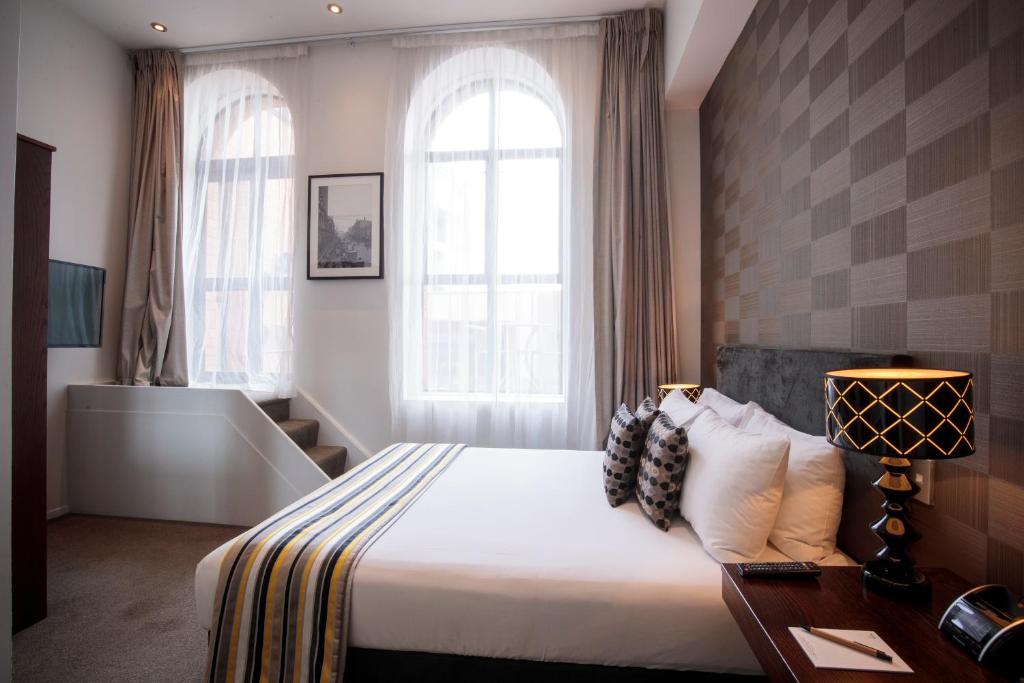 Postel nebo postele na pokoji v ubytování Hotel 115