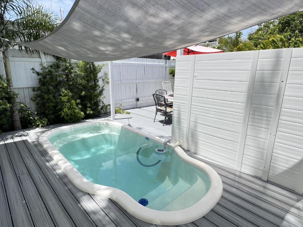 a jacuzzi tub on the deck of a house at Island Paradise in Key West