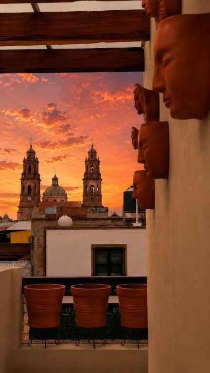a view of a sunset from a balcony at Casa Aldama 59 in Morelia