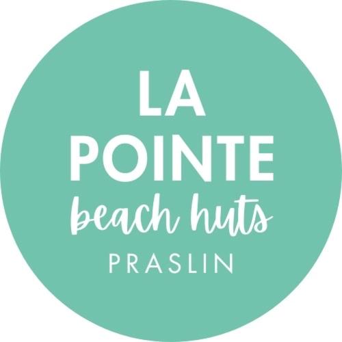 a circle with the words la pointe beach hitsrush at La Pointe Beach Huts in Praslin