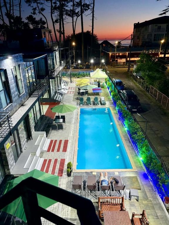 an overhead view of a swimming pool at night at Blue Horizon Apartments in Ureki