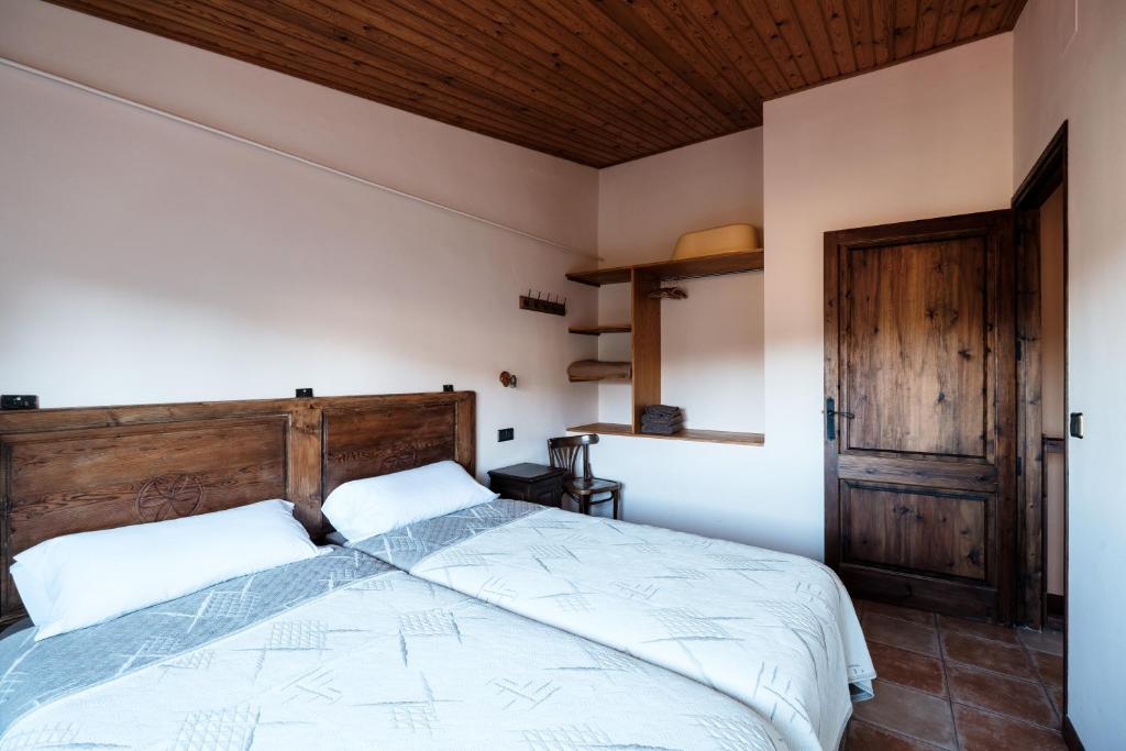 Postel nebo postele na pokoji v ubytování Els Masos d'en Coll
