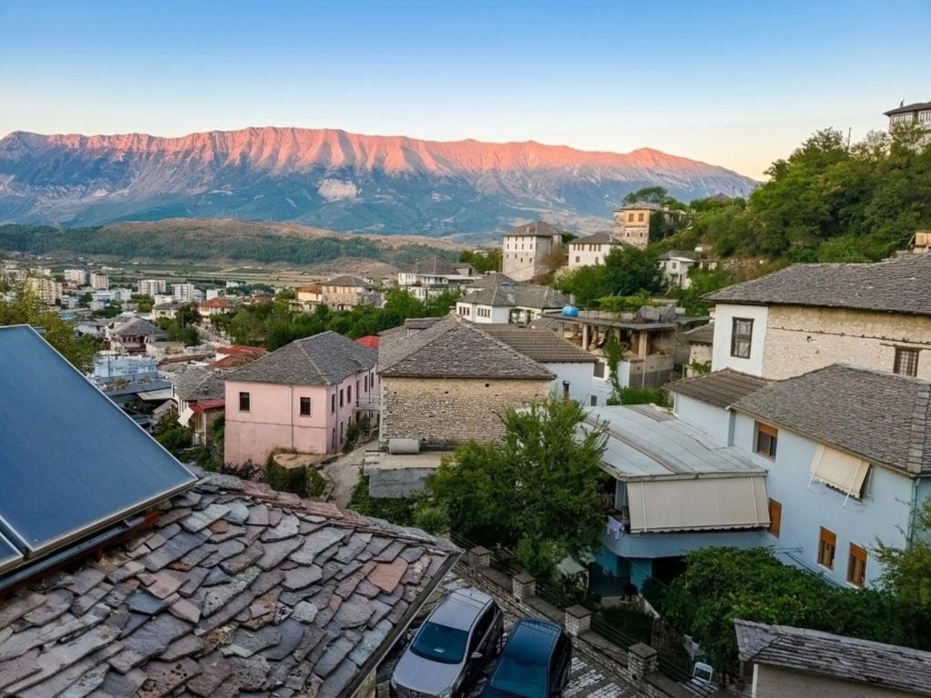 an aerial view of a town with mountains in the background at House in the old town with view in Gjirokastër