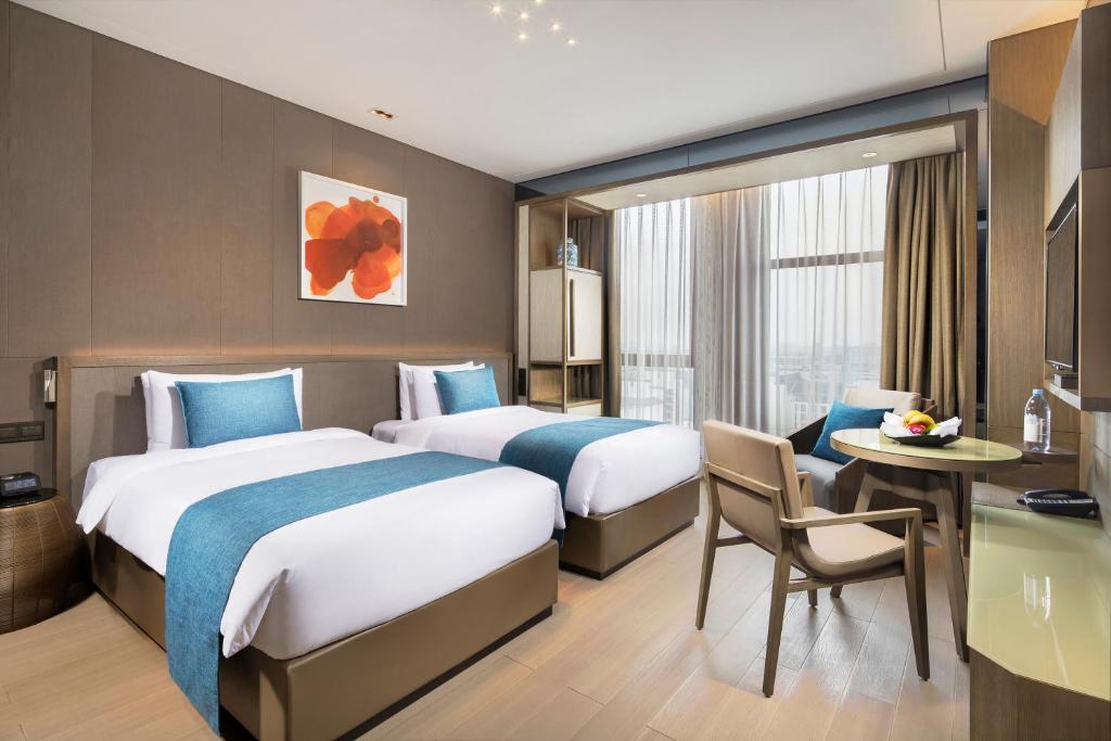 Postel nebo postele na pokoji v ubytování Novotel Shanghai Clover