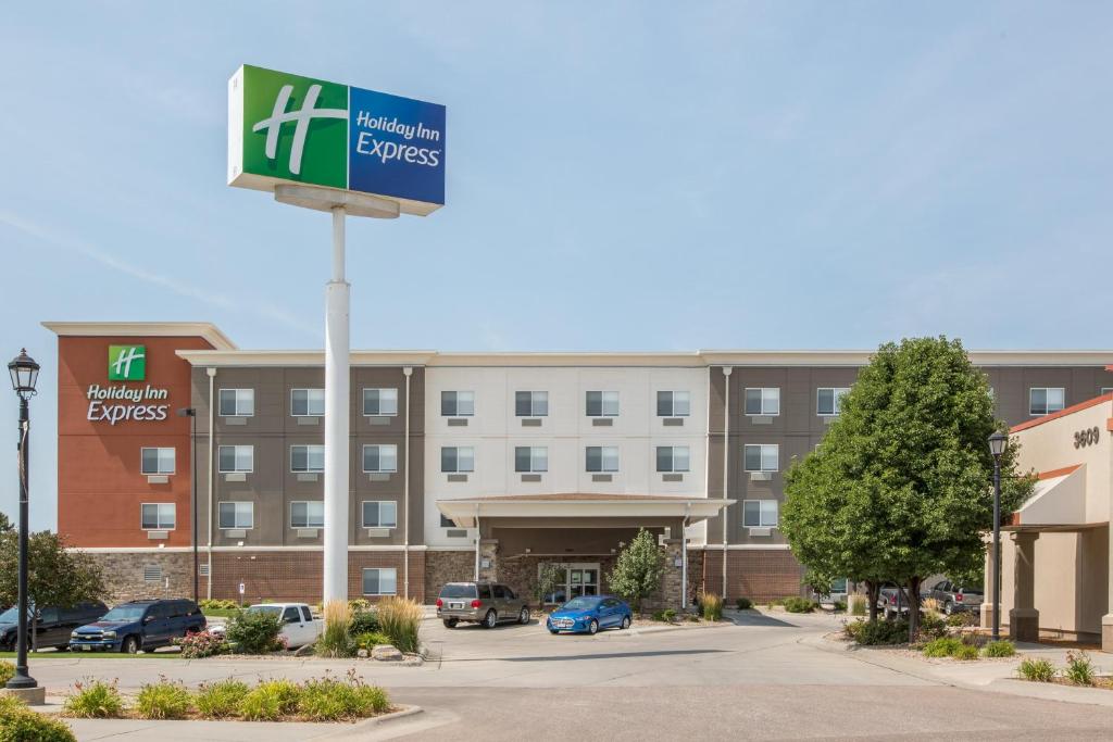 a sign in front of a hotel at Holiday Inn Express Hastings by IHG in Hastings