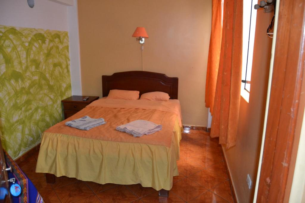 Postel nebo postele na pokoji v ubytování Aldos Guest House