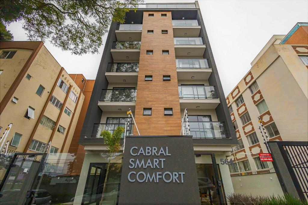 a sign in front of a apartment building at Cabral Smart Comfort in Curitiba