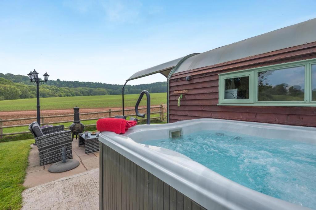 a house with a hot tub in the backyard at 1 Bed in Hereford oc-81293 in Aconbury