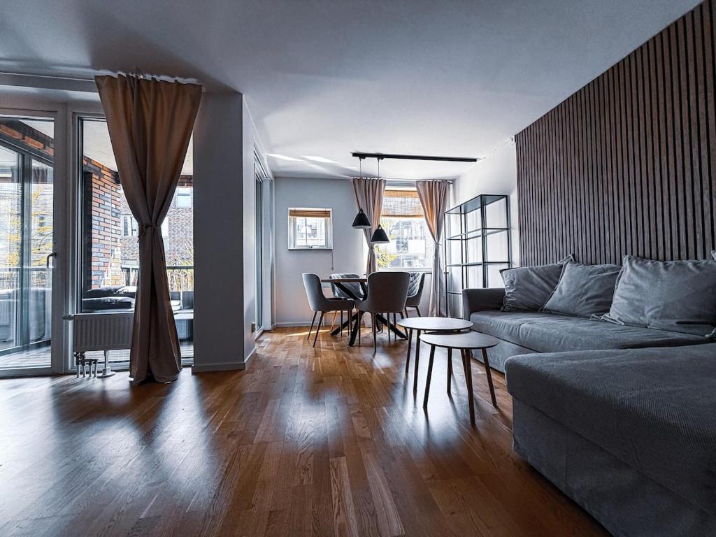 a living room with a couch and a table at Apartment in Höganäs
