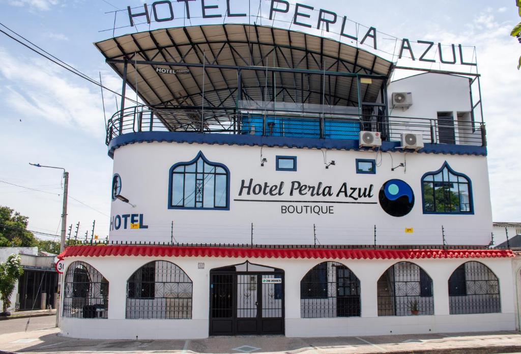 a building with the words hotel palaanu on it at Hotel Perla Azul Girardot in Girardot