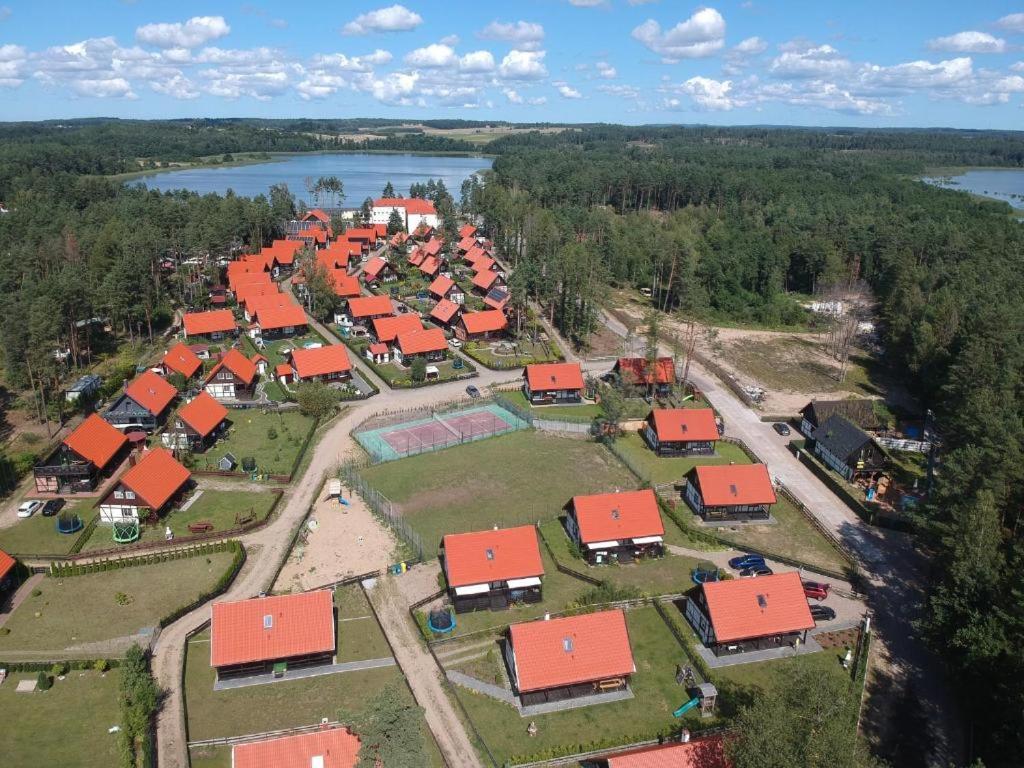 an aerial view of a village with red roofs at Domek Na Gwizdówce nr52 in Załakowo