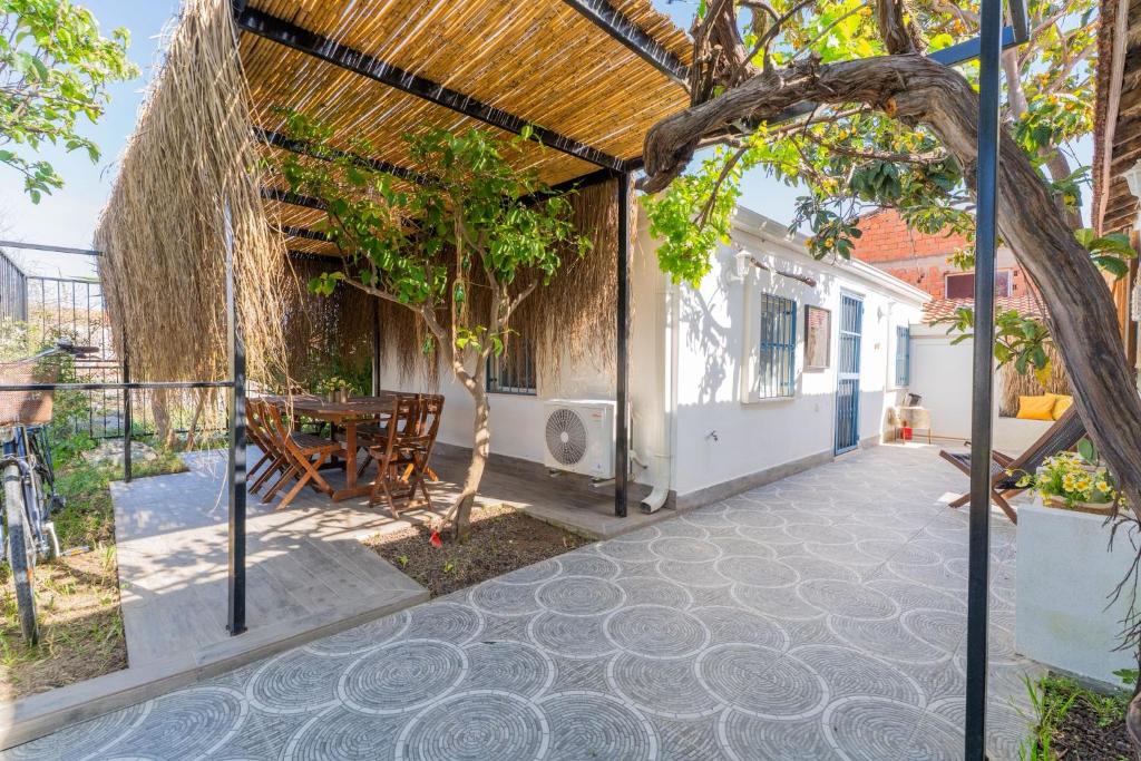 an external view of a house with a patio at Nar Suites Alacati in Çeşme