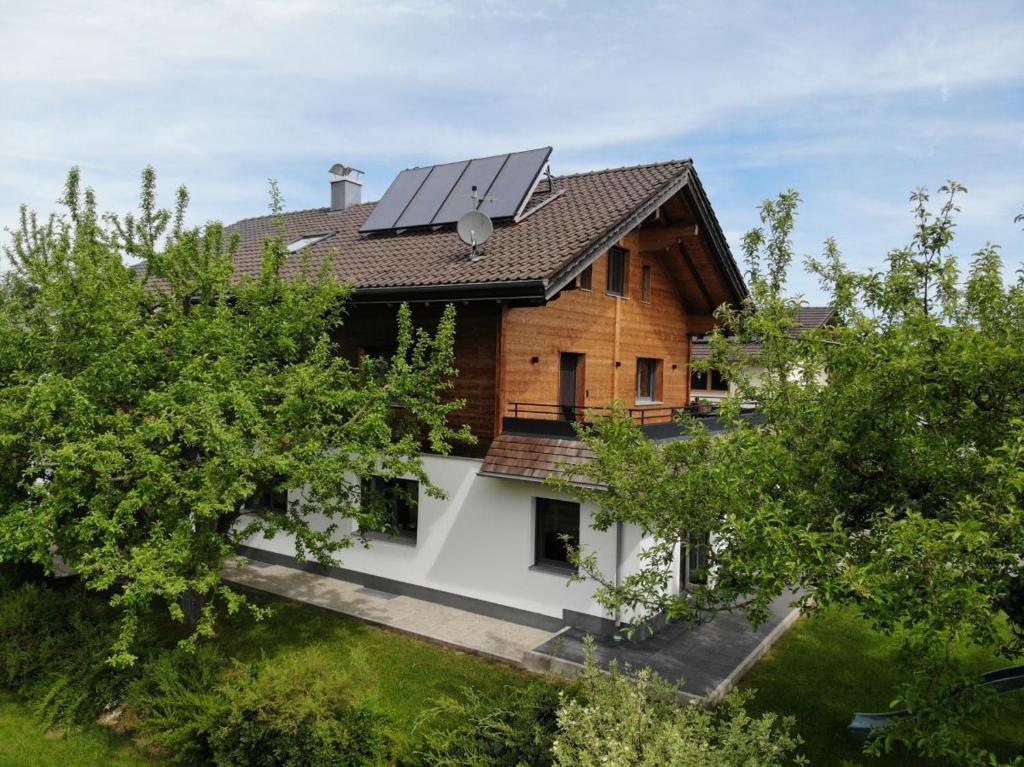 a house with solar panels on the roof at Sonnseite in Punschern in Teisendorf