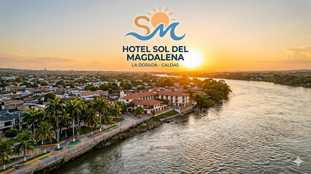 an aerial view of a city with a river at Hotel Sol del Magdalena in La Dorada