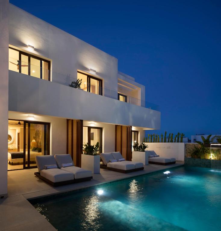 a villa with a swimming pool at night at Ananda Mojácar - Only Adults in Mojácar
