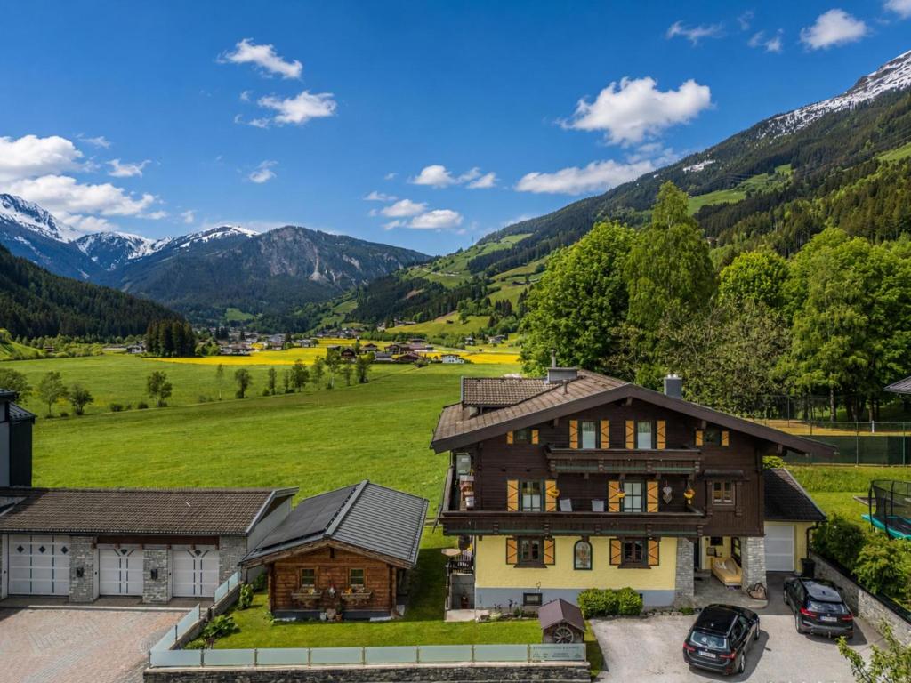 an aerial view of a house with mountains in the background at Elisabeth II in Wald im Pinzgau