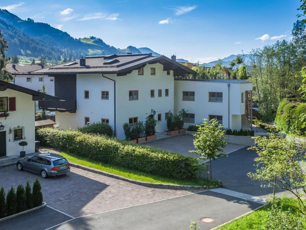 an aerial view of a house with a parking lot at Kitz Apartments Top 6 in Kitzbühel