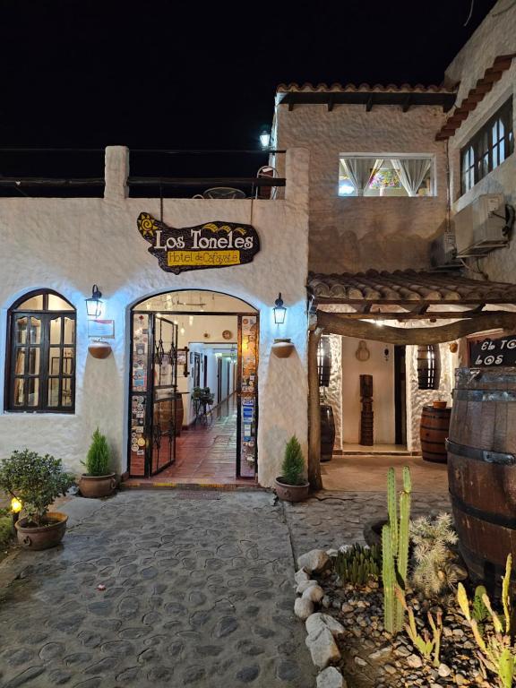 a store with a sign on the front of a building at Los Toneles Cafayate in Cafayate