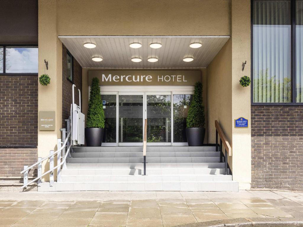 a front entrance to a mentre hotel with stairs at Mercure Bedford Centre Hotel in Bedford