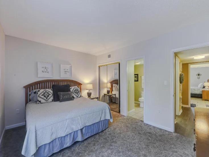 a bedroom with a large bed and a bathroom at WP531 Come on Inn in Pigeon Forge