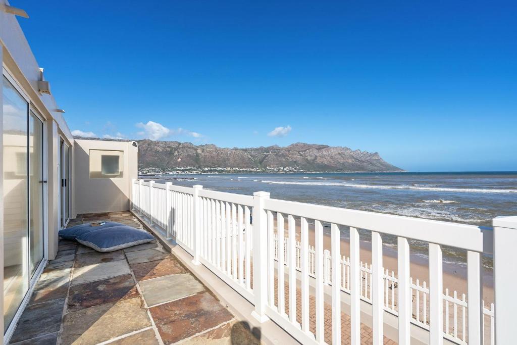a balcony with a view of the ocean at Sea Haven 4 in Gordonʼs Bay