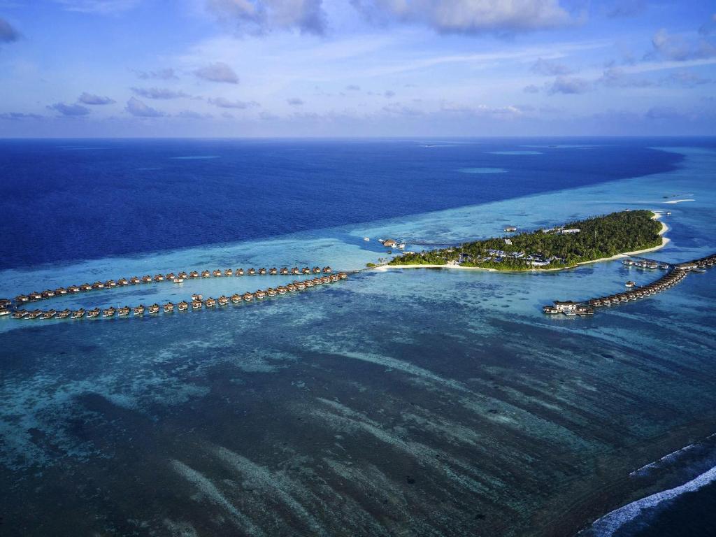 an aerial view of an island in the ocean at Pullman Maldives Maamutaa - All-Inclusive Resort - 50 percent off Domestic Transfers in Maamutaa