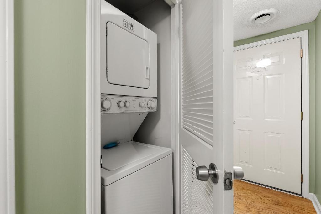 a kitchen with a white refrigerator and a white door at WP231 Old Mill Overlook in Pigeon Forge