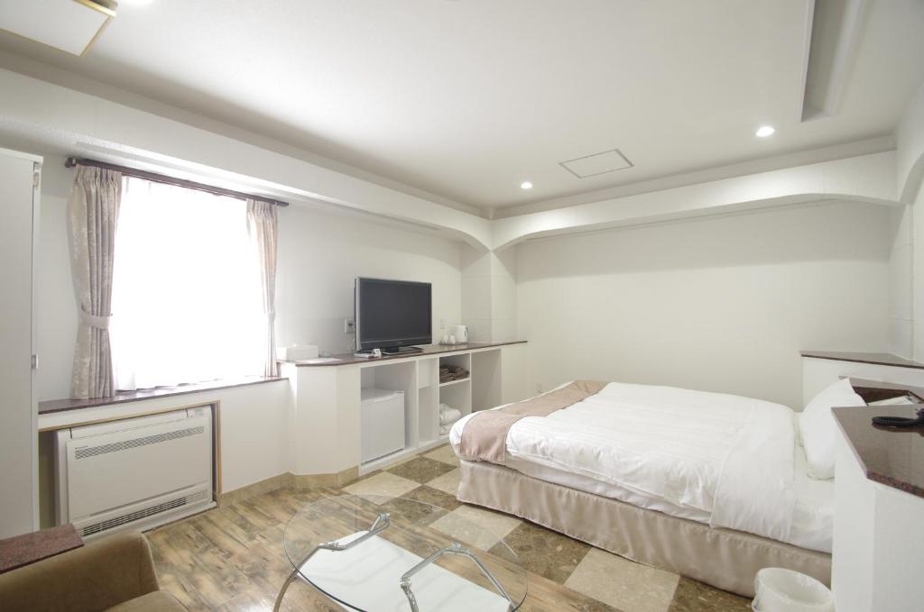 Televiisor ja/või meelelahutuskeskus majutusasutuses Hotel Imalle Yokohama Isezakicho