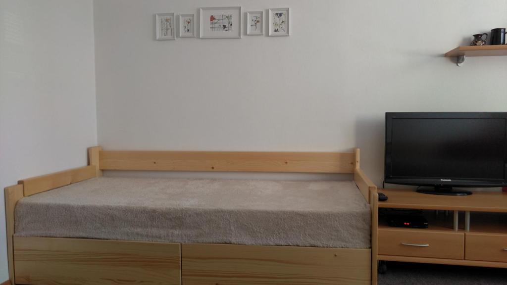 Postel nebo postele na pokoji v ubytování Apartmány Hágy L+L