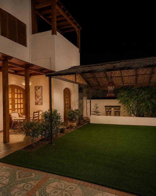 a courtyard of a house with a green lawn at Modern Villa in Dahab in Dahab