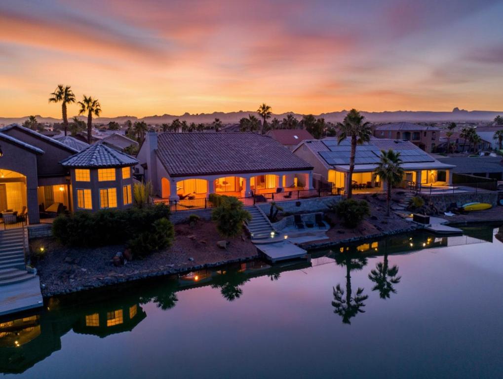 an aerial view of a house with a pool of water at Lake House in Fort Mohave