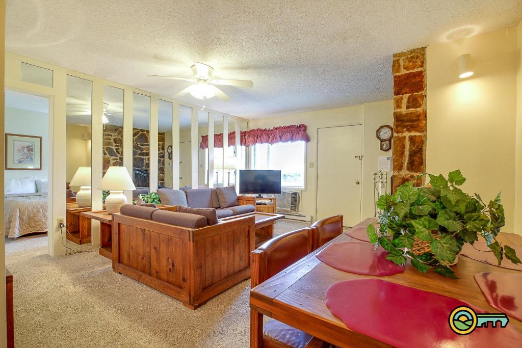 a living room with a couch and a table at Aspen East Unit #101 in Basye