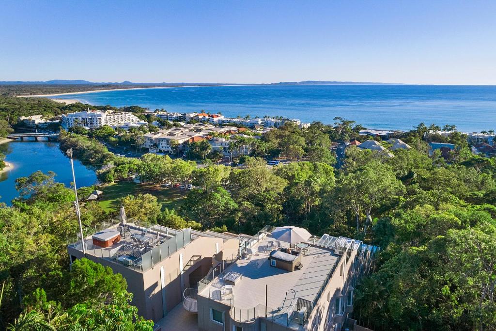 an aerial view of a resort and the ocean at Picture Point Terraces in Noosa Heads