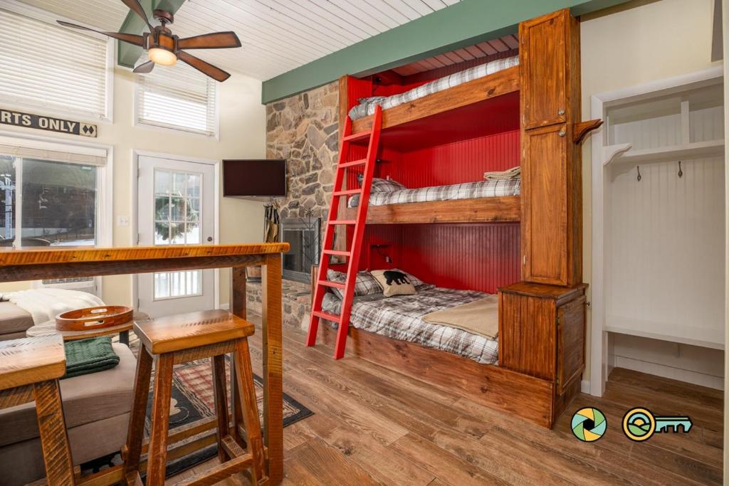 a bedroom with two bunk beds and a desk at Aspen East Unit #231: Slippery Slope in Basye