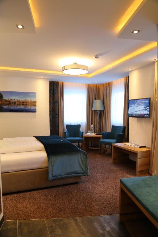 Postel nebo postele na pokoji v ubytování Hotel Vogt