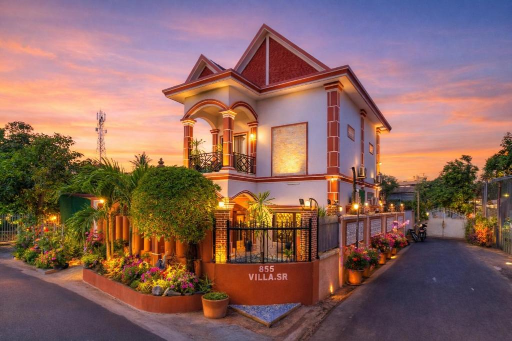 a house with flowers on the side of a street at 855 Villa Siem Reap in Siem Reap
