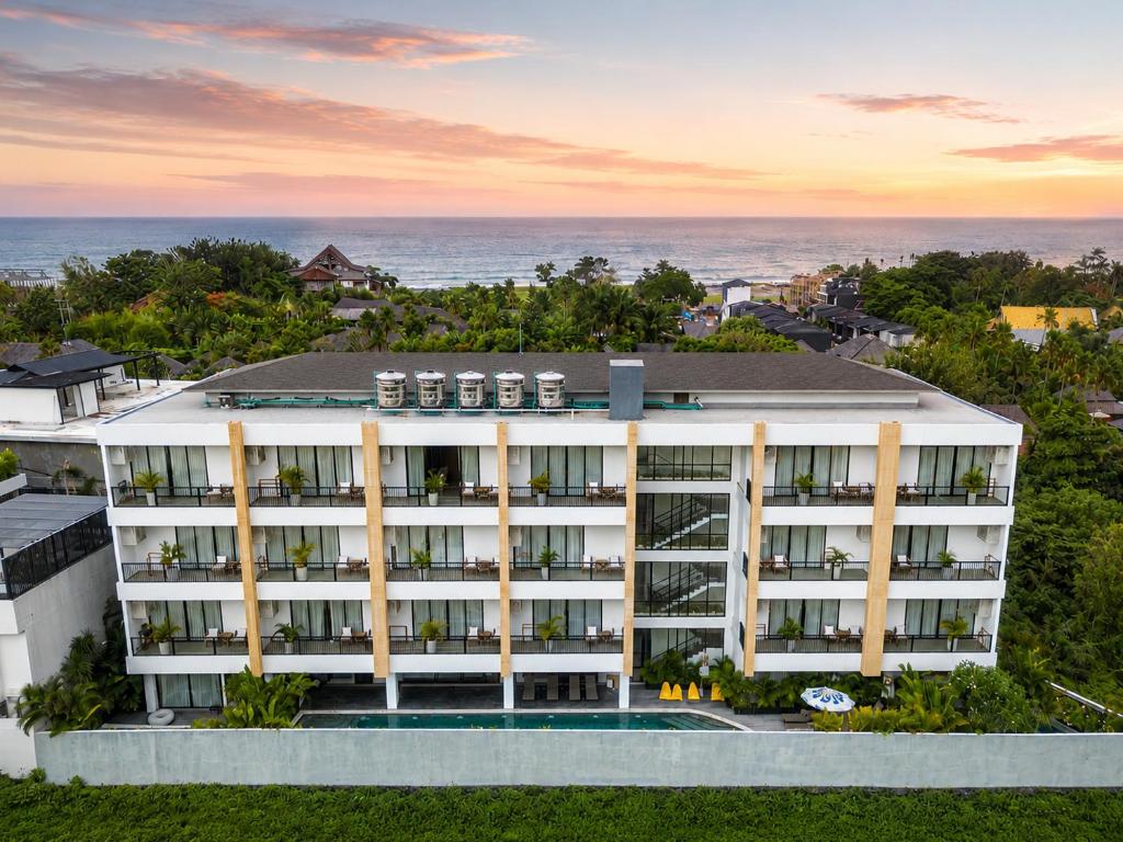 an aerial view of a hotel with the ocean in the background at Sunny Aparts 1 by Betterplace in Canggu