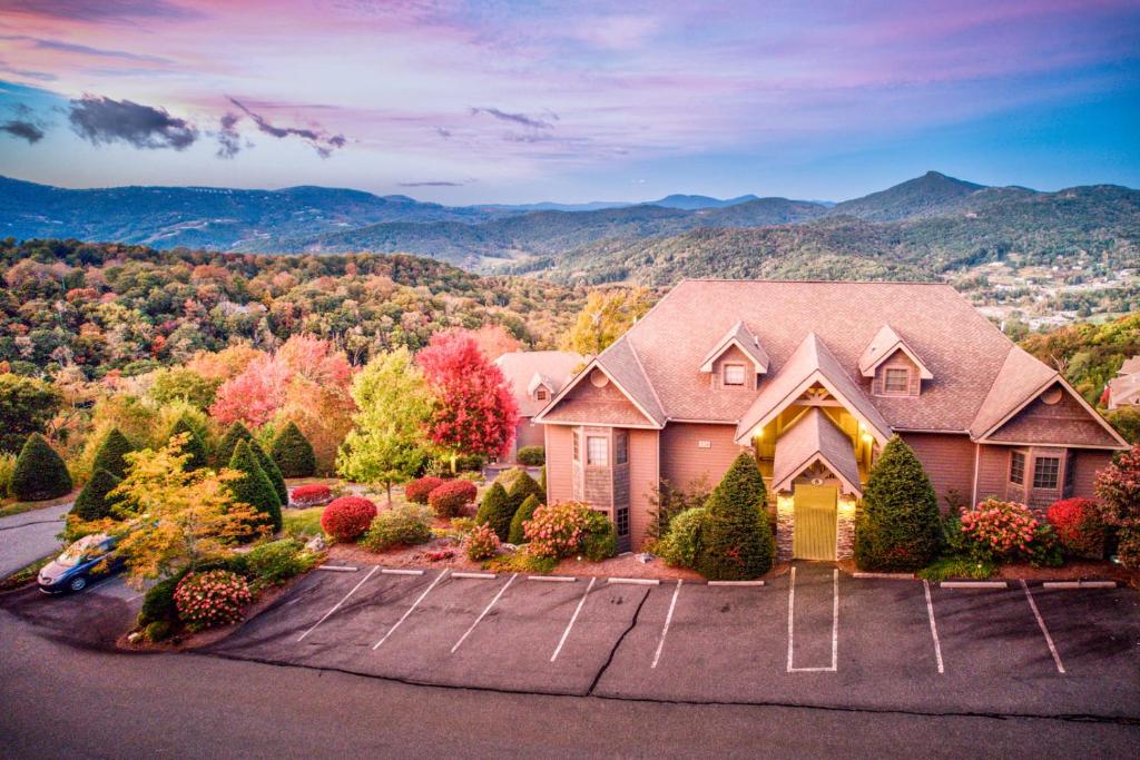 a large house with a view of the mountains at Sugar Sky at The Reserve II in Sugar Mountain