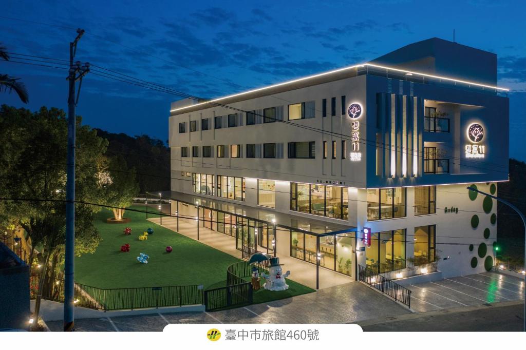 a building with a lawn in front of it at Shineworld 11 in Shalu