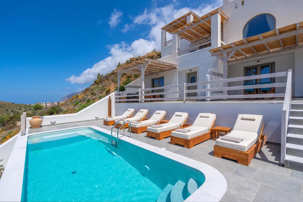 an image of a villa with a swimming pool at Epsilon Apartments in Kalymnos