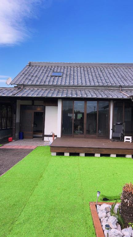a house with a green lawn in front of it at Stonehouse2 in Usa