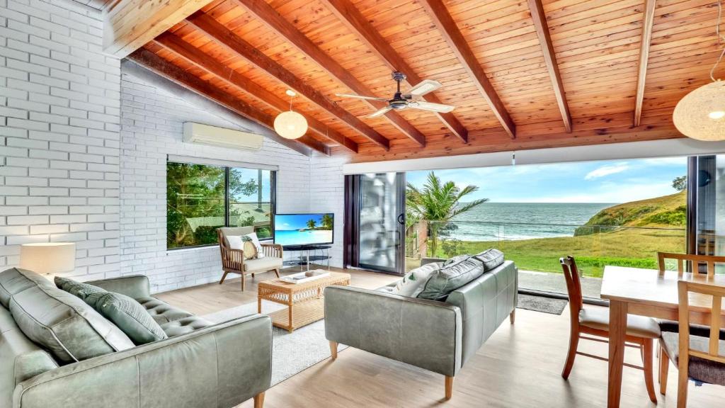 a living room with a view of the ocean at The Cove in Scotts Head