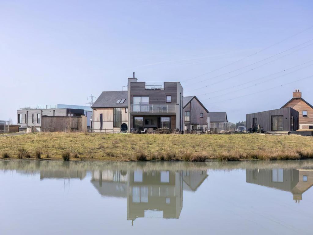 a house on the edge of a body of water at Willowmere in Dorchester
