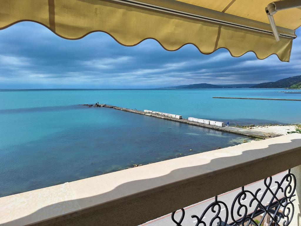 a view of the ocean from a balcony at Apartment Maraya 2, Carpe Diem complex, Balchik, free parking in Balchik