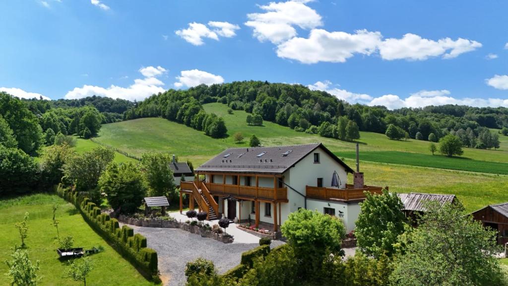 an aerial view of a house in a field at Agroturystyka Natura in Pilchowice