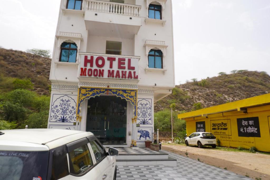 a hotel moon market with a car parked in front of it at Hotel Moon Mahal in Jaipur