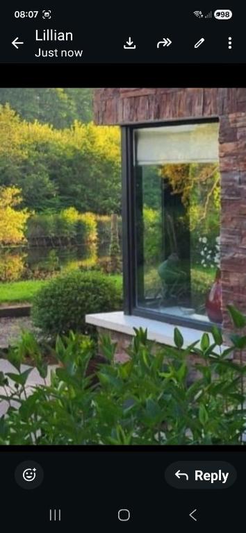 a screenshot of a window of a house at the ring of kerry riverside apartment in Killorglin